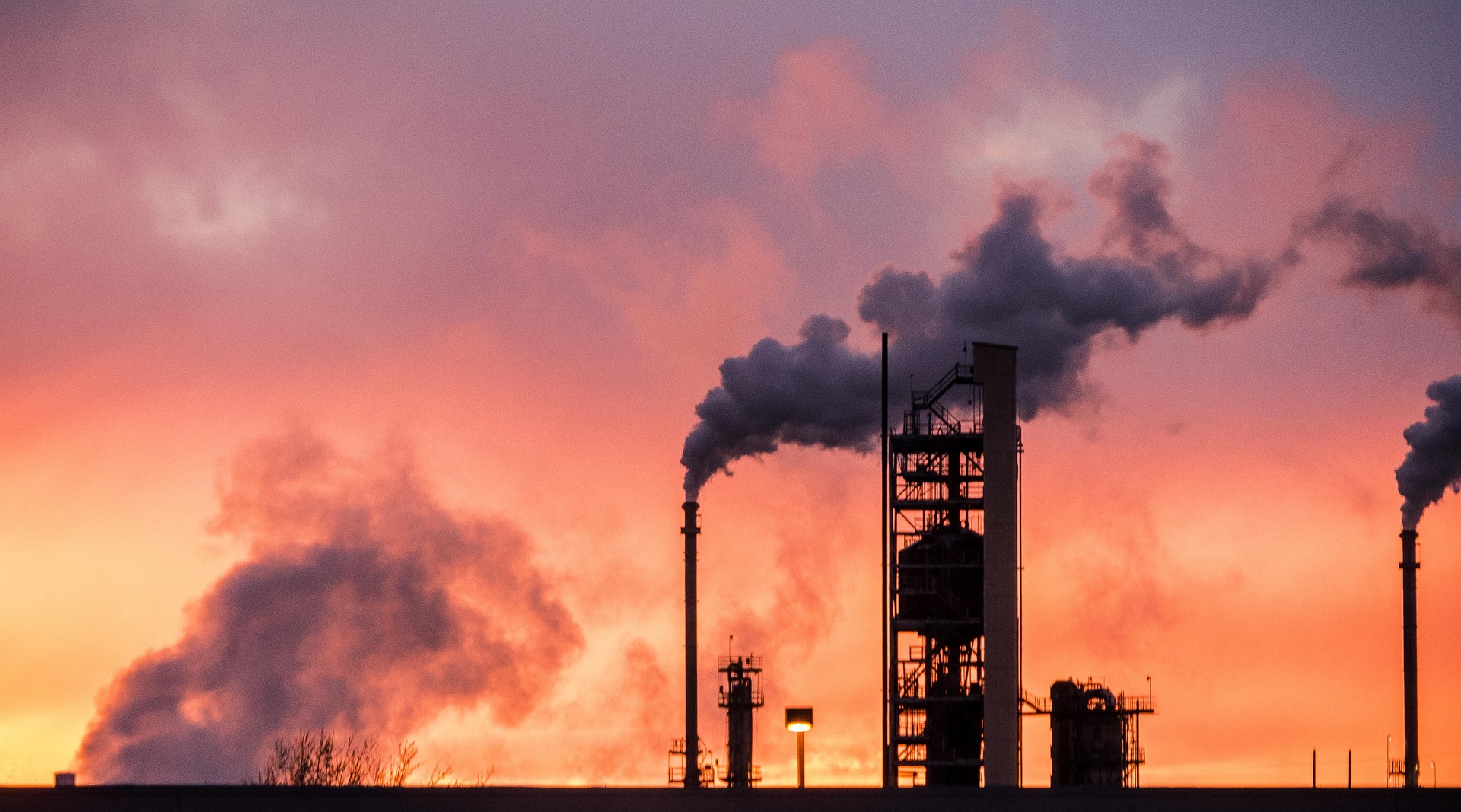 Oil refinery at sunset